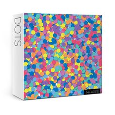 a box with colorful confetti on the front and sides, all in different colors