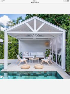 an outdoor living area next to a swimming pool