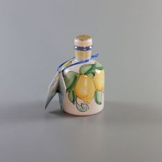 a small bottle that has some lemons on it