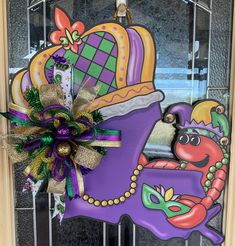 a purple door with a mardi gras decoration on it