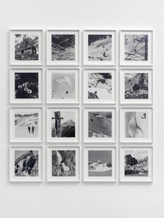 black and white photographs hanging on a wall