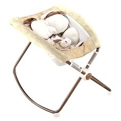 a baby swing with stuffed animals in it