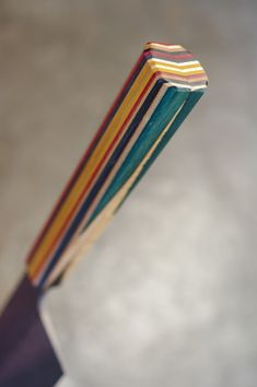 a multicolored toothbrush sticking out of its holder