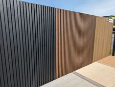 the side of a building with wooden slats on it