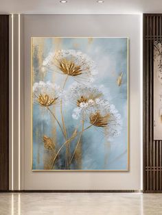 a painting on the wall in a living room with white and gold flowers painted on it