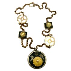 JEAN PAUL GAULTIER vintage steampunk watch necklace. Chunky gold tone chain featuring gears, two small watch dials and a massive watch pendant. Spring ring closure. Marked GAULTIER. Indicative measurements : length of the chain approx 91.5 cm (36.02 inches) / diameter of the round watch pendant approx. 6.1 cm (2.40 inches). Comes with the original dust bag (used condition). NOTES - This is a preloved vintage item, therefore it might have imperfections. - Colors may differ slightly from actual pr Round Watch, Steampunk Watch, Small Watch, Jean Paul, Jean Paul Gaultier, Watch Necklace, Spring Rings, Gold Tones, Vintage Items