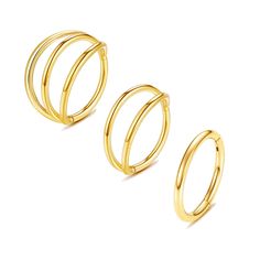 three gold rings sitting next to each other