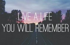 a long road with the words live a life you will remember