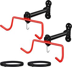 two black and red hooks are attached to the back of a pair of wall brackets