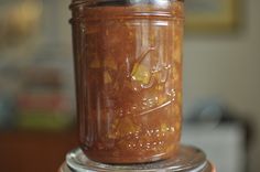 a glass jar filled with food sitting on top of a table