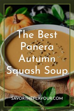 the best panera autumn squash soup in a white bowl surrounded by pumpkins and leaves