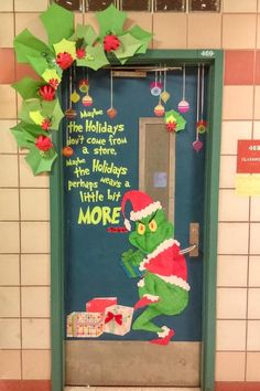 the grinch door decoration is decorated with christmas decorations