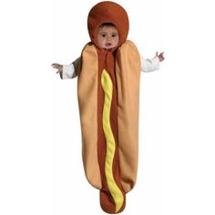 a little boy dressed in a hot dog costume