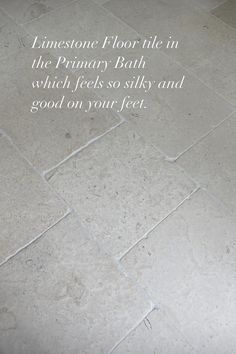 a bathroom floor with white tile and the words, innestone floor tile in the primary bath which feels so softly and good on your feet