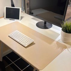 a computer desk with a keyboard, monitor and mouse sitting on it's side