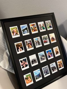 a black frame with many different pictures on it