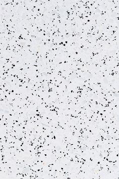 a white and black speckled surface is shown