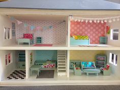 a doll house with furniture and accessories in it