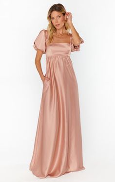 Hearts a flutter in the Nora Maxi Dress! This flattering maxi has a square neckline with a smocked back to ensure the perfect fit on your bust. The empire waist makes this a great dress for moms-to-be! For the bridesmaid who loves a floaty, romantic sleeve moment, or anyone with a special event to attend. Boho Vision Board, Metallic Bridesmaid Dresses, Light Pink Bridesmaids, Light Pink Bridesmaid Dresses, Pastel Bridesmaid Dresses, Dress Rose Gold, Blush Pink Bridesmaids, Neutral Bridesmaid Dresses, Maternity Bridesmaid Dresses