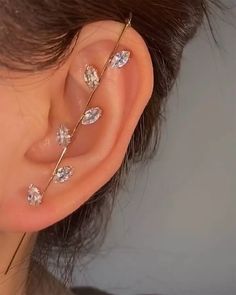 a close up of a person with ear piercings