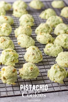 some cookies are cooling on a rack and ready to go into the oven for baking