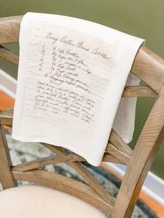 a chair with a handwritten note on it