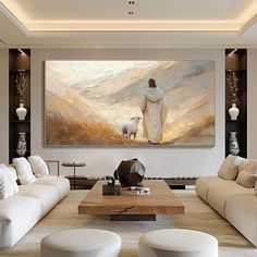 a living room filled with furniture and a large painting on the wall above it's coffee table