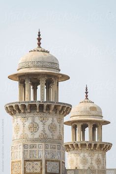 an ornate building with two towers on the top and one at the bottom by helen happle for stocks & bond