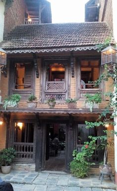 an old building with plants growing on it