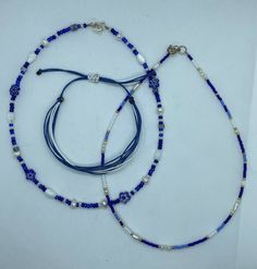 Pretty Girl Bundle - blue, white and gold necklace and bracelet set. Two beaded necklaces and one adjustable wax string bracelet. Both necklaces measure at 14.5 inches. All jewelry is handmade. Jewelry Stacking, Necklace And Bracelet Set, Bracelets Diy, Stacked Jewelry, Beaded Bracelets Diy, Necklace And Bracelet, String Bracelet, Beaded Necklaces, Summer Jewelry