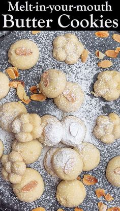 a pan filled with cookies covered in powdered sugar