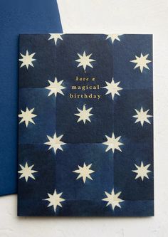 a blue and white card with stars on it