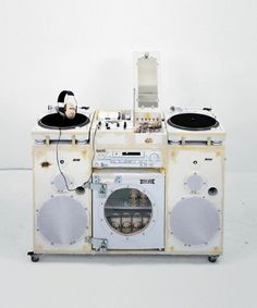 an old fashioned record player with headphones on it's sides and two turntables