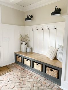 a bench with baskets on it in a room