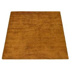 an orange rug on a white background with no one in it or someone else is looking at the carpet