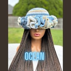 a wig with braids and a hat on it