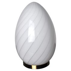 an egg shaped lamp is shown on a white background