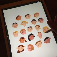 a person is holding an ipad with stickers on it that show people's faces