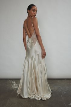 the back of a woman's dress in white