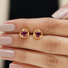 Product Details Designed with elegance, these Swirl Stud Earrings crafted in Solid Gold are Adorned with Round Cut Rhodolite Solitaire to complement your attire for special occasions. Product Information SKU SHP-EARRINGS062196639 Length 9 mm Width 9 mm Height 3.7 mm Weight 2.02 gm (Approximate) RHODOLITE INFORMATION No.of Stones 2 Pieces Total Weight 1.20 Carat (Approximate) Dimension(approx) Round-5X5 mm-2 Pcs Color Red Cut Brilliant Shape Round Setting Type Prong-Setting Quality Grade AAA View One Stone Earrings Gold, Single Stone Earrings Gold, Stone Studs Earrings Gold, Coral Earrings Gold Indian, Solitaire Earrings Studs, Earrings Gold Design, Gold Earrings Studs Simple, Simple Diamond Earrings, Antique Necklace Gold