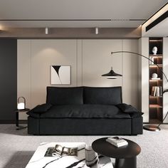 a modern living room with black furniture and white carpeted flooring, along with bookshelves