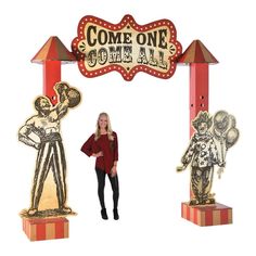 a woman standing in front of a sign that says come one o'clock carnival