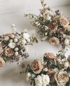 flowers are arranged on the floor next to each other