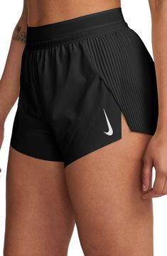 the nike women's running shorts are black and white