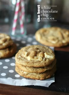 white chocolate chip cookies stacked on top of each other