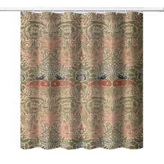 a shower curtain with an ornate design on it's side and a blue bird perched on top of the curtain