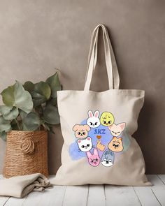 "Beautifully made Stray Kids tote bag for all of our amazing STAY's out there! This SKZ tote is the perfect Stay Kids fan-made merch gift for any STAY's or Kpop Fan! ❤️   This 100% cotton bag comes in one size - 15\" x 16\"- perfect for everyday wear. While the canvas material will show off your designs in great colors, it's durable and will last for years. The bag features 20\" handles (made from the same canvas), making it easy to carry even with a week's worth of shopping. .: 100% cotton canv Wolf Chan, Kids Tote Bag, Stay Kids, Kids Totes, Chan Lee, Kids Fans, Canvas Making, Locked Wallpaper