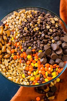 a bowl filled with candy corn and chocolate chips