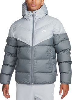 Fit & Design: Relaxed fit puffer jacket Gives you room to layer up underneath for those extra chilly days Designed to feel relaxed through the chest and body Smooth taffeta lining provides added warmth Zippered side pockets offer storage for the essentials 2-way front zipper lets you customize your fit Elastic cuffs and hem provide a more comfortable fit Technology: Nike® Storm-FIT technology resists elements like wind and water to help keep you comfortable in harsh weather conditions PrimaLoft Thermoplume insulation offers a premium alternative to down that doesn't sacrifice on heat retention Water-repellent and windproof woven fabric, with color blocking on select colorways Nike Puffer Jacket, Nike Puffer, Nike Website, Nike Windrunner, Hooded Puffer Jacket, Puffy Jacket, Athletic Apparel, Puffer Jacket, Outerwear Jackets