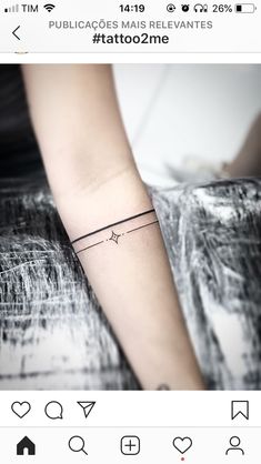 a woman's arm with a small tattoo on the left side of her arm